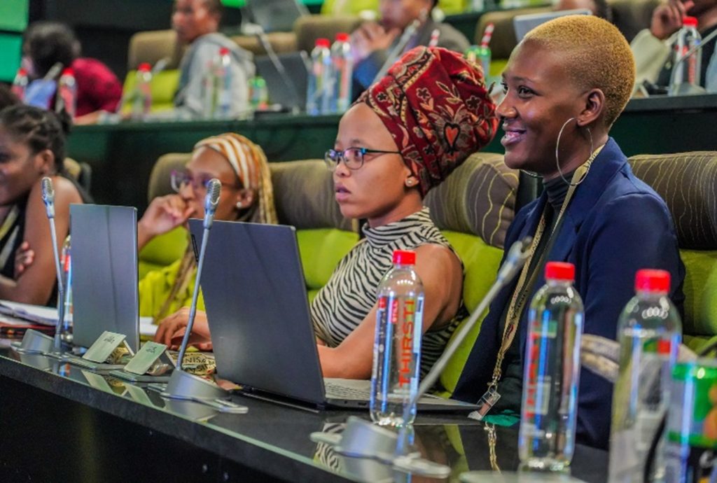 View of female participants during a plenary session on AI