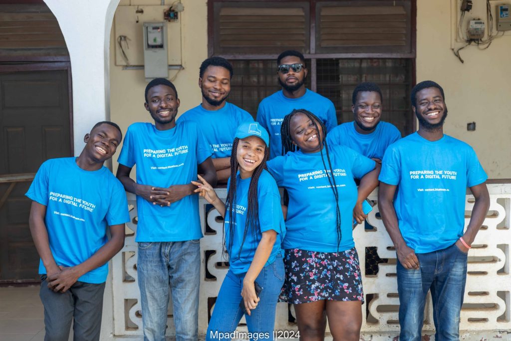 Group of young people in blue shirts that read 'Digital Achievers Project'