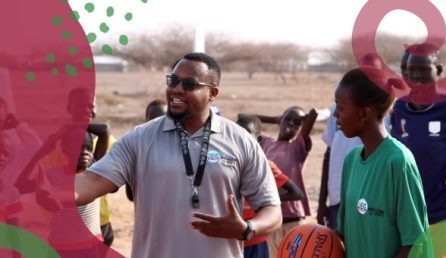 Basketball trainer and youth during a training session.